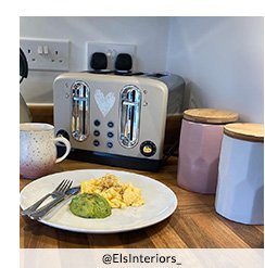 A kitchen counter with a set of three geometric pastel storage canisters, a cream toaster and kettle set, a pink and white ombre mug and a white plate with eggs and avocado
