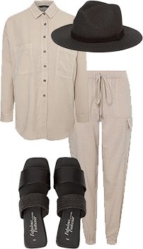 A black wide brim hat, natural longline shirt, nude sheen cargo joggers and black mule sandals
