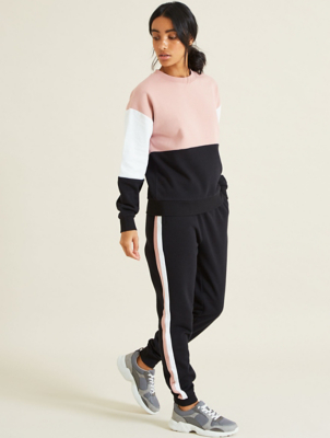 black tracksuit bottoms with white stripe