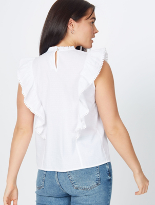 white sleeveless frill blouse