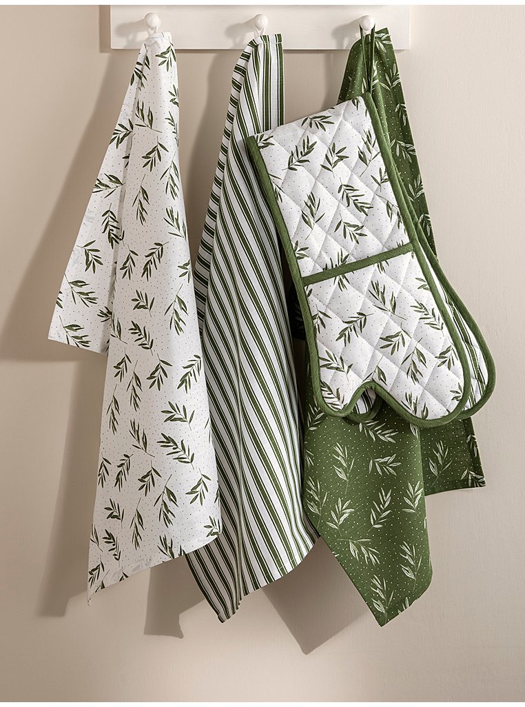 Domestic kitchen towels and tea cloths, and oven gloves, hanging