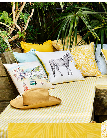 Scatter wildlife and seaside-inspired cushions around the home