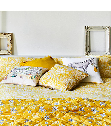 Add sunshine to the bedroom with yellow floral bedsheets