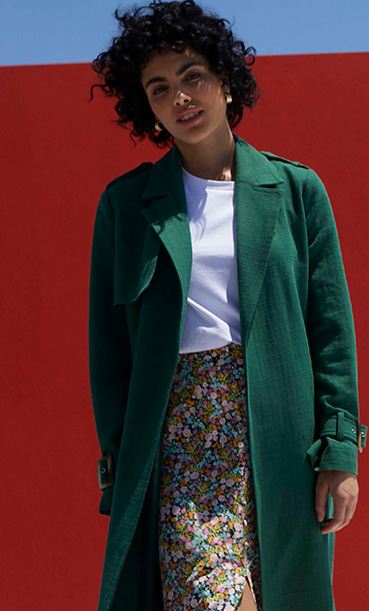 Try a bottle green coat or bright dress 