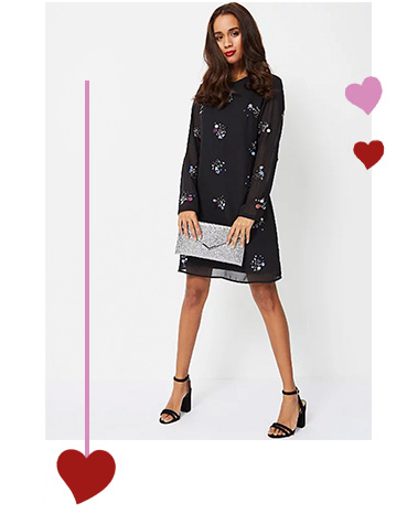 Team your patterned dress with heels and a clutch bag for a stylish look