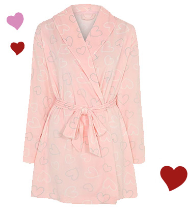 This pink dressing gown, designed with pretty hearts dotted all over, is made from fleece material for extra softness and warmth