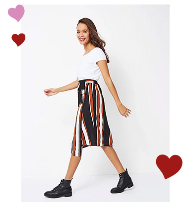 This boldly striped midi skirt has a fluid wrap construction and autumnal hues
