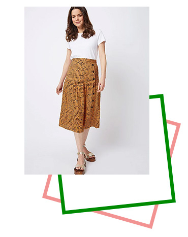 Made with a buttoned side design, this midi skirt is a stunning piece you’ll love to wear