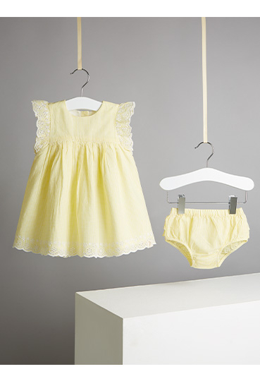 Dress your little sunshine in this yellow gingham dress and bloomers outfit