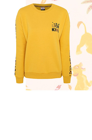 Add a dash of Disney couture to your casual wardrobe in this cosy yellow sweatshirt