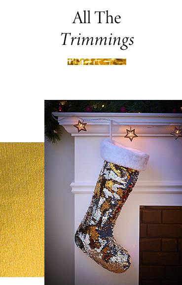 Gold sequin stocking hanging from a mantelpiece