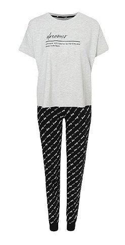 Woman’s pyjamas with white slogan t-shirt and black patterned leggings