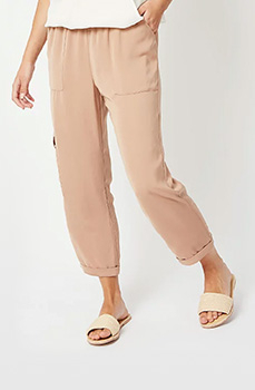 Comfortable and stylish, rock these beige utility trousers with nude sliders