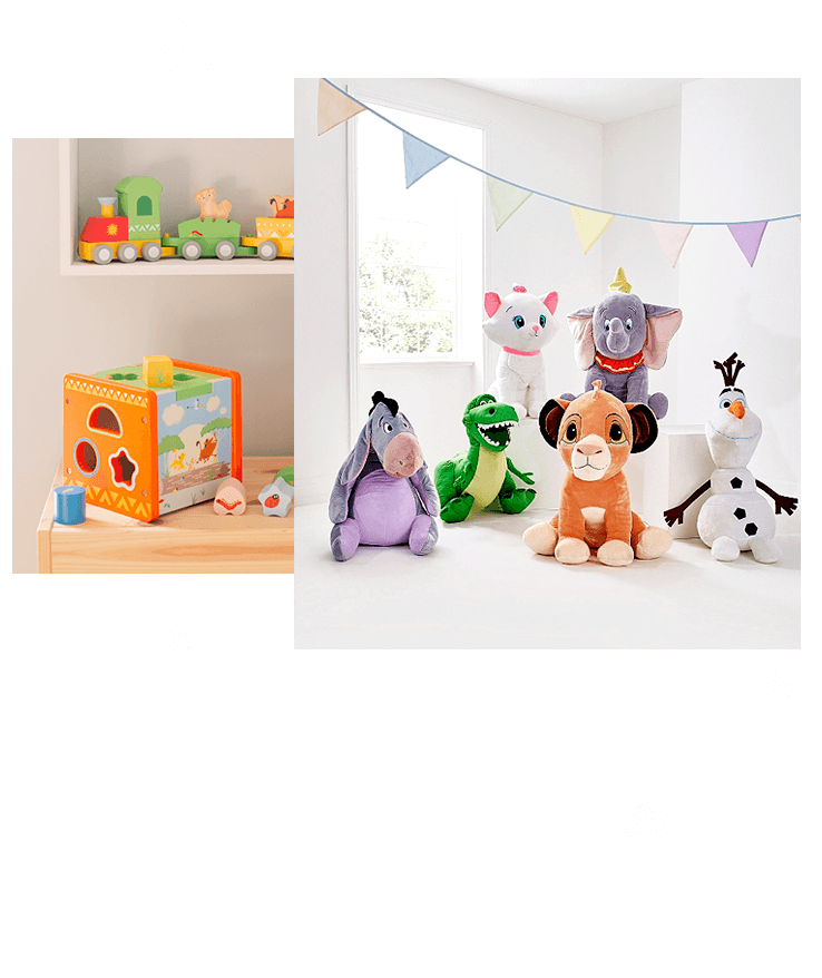 Wooden train, building set and hoops laid on top of wooden table, Disney jumbo plush toys on white floor with colourful bunting hanging in the background.