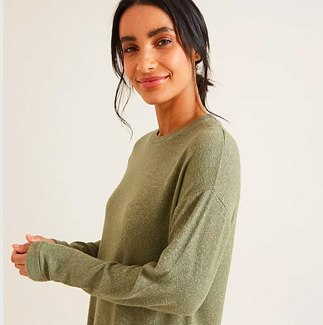 Woman wearing khaki long sleeve top