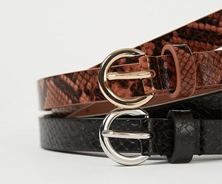 Two snake print belts on top of each other, one brown with a gold buckle and one black with a silver buckle