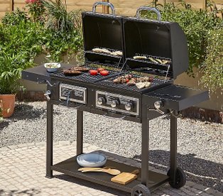 Uniflame classic black gas griddle on a garden patio.