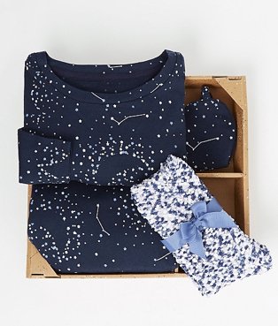 Navy pyjama set folded in a gift box.