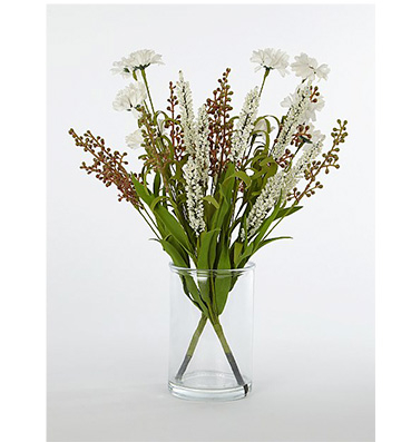 A bouquet of white flowers in a clear vase