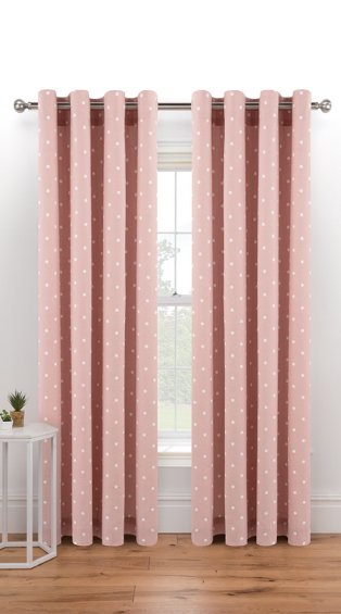 Large white window features pink spotty eyelet curtains hanging from silver-tone curtain rail.