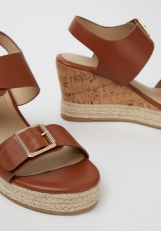 Tan wedge heel sandals.