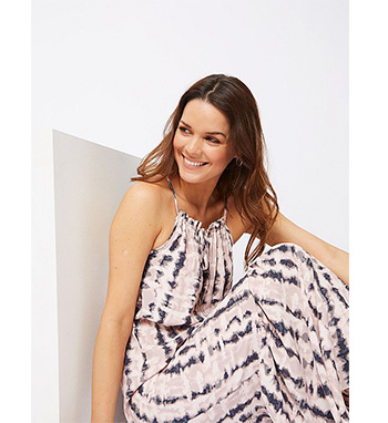 Light and breezy, this soft pink patterned maxi dress features a halterneck design you'll love