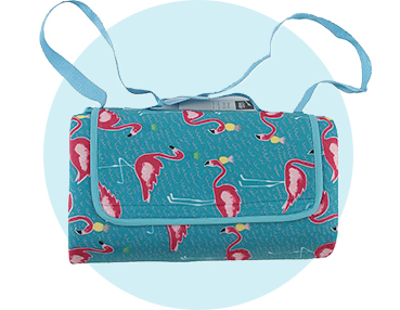 Imagine you’re enjoying a picnic in a tropical paradise with this blue flamingo picnic rug