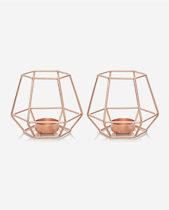 Two rose gold geometric tealight candle holders