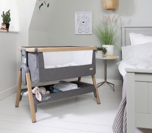 Bedroom features double bed with side table topped with artificial plant and oak and charcoal Tutti Bambini Cozee crib.