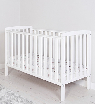 White cot in a room