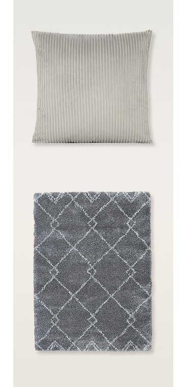 Grey cushion and grey rug with diamond pattern rug