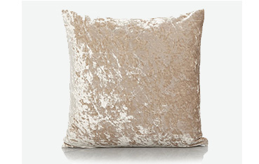 Champagne-coloured crushed velvet cushion