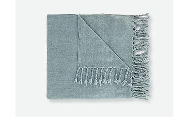 Soft blue throw with tassels