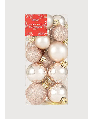 A selection of rose gold baubles in a box