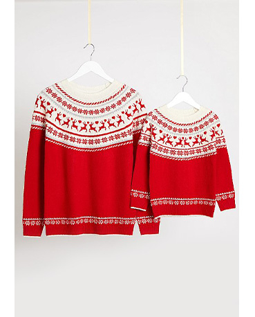 Matching adult and child red Christmas jumpers