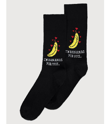 Product image of black socks with bananas surrounded by love hearts and the slogan 'I'm bananas for you'
