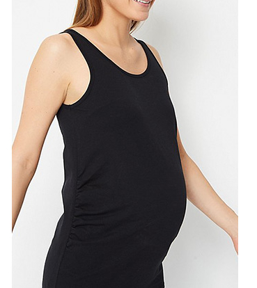Pregnant woman wearing black maternity sleveless dress