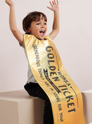 World Book Day 2020 - Boy with his arms raised in happiness wearing a Roald Dahl Willy Wonka Golden Ticket costume