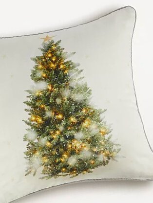 Natural Christmas tree cushion with contrast piping and gold metallic detailing.