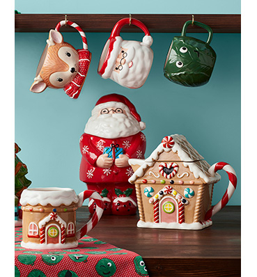 Christmas kitchen mugs and ornaments on a table