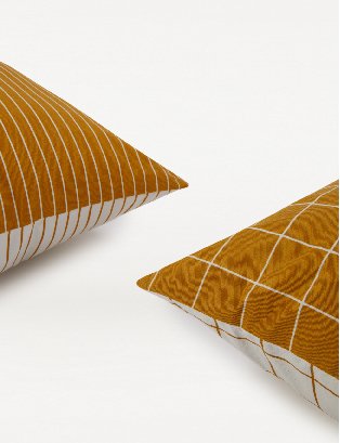 Orange stripe and square print cushions.