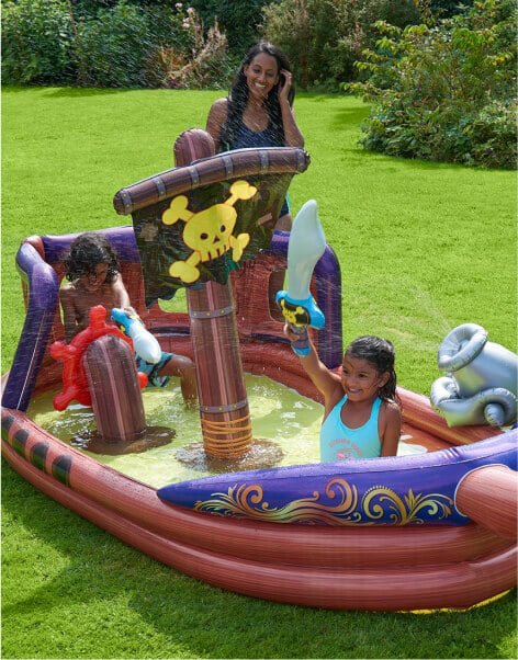Children playing with a pirate splash pool.