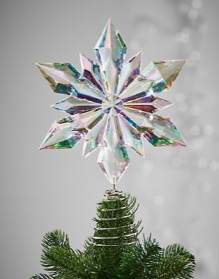 Artificial Christmas tree features iridescent star.