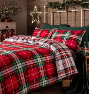 Double bed with a red checked bedding set.