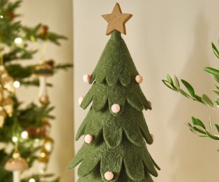 Green Christmas tree decoration with gold star.