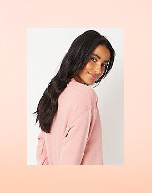 Woman in pink slouchy jumper