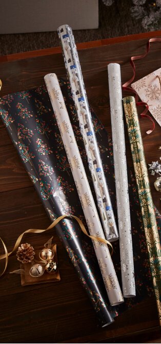 A selection of wrapping paper and ribbon on a table.