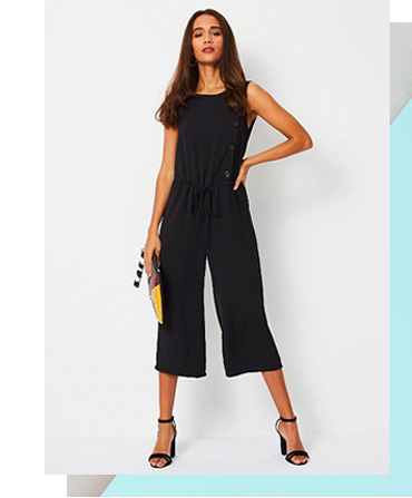 This black sleeveless jumpsuit comes in a lightweight fabric with a button-down side