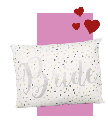 This cushion is patterned with polka dots and a shimmery silver print 'Bride' slogan