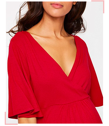 Liven up your pregnancy wardrobe with this vibrant red wrap style dress